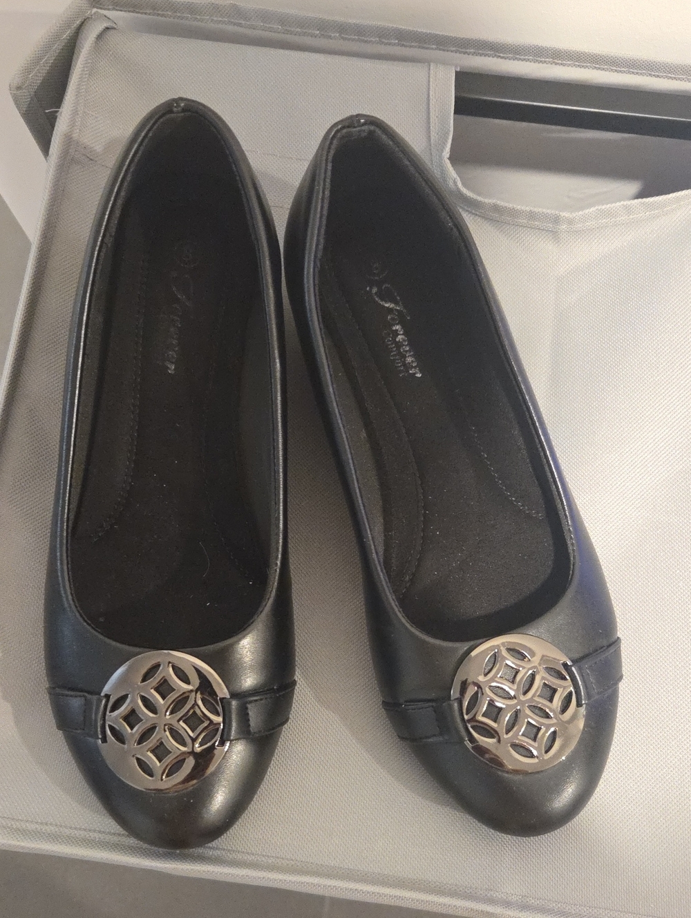Women’s Black Ballet Flats with Decorative Medallion